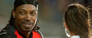 HOBART, AUSTRALIA - JANUARY 04:  Chris Gayle of the Melbourne Renegades gives a TV interview to Mel Mclaughlin during the Big Bash League match between the Hobart Hurricanes and the Melbourne Renegades at Blundstone Arena on January 4, 2016 in Hobart, Australia.  (Photo by Darrian Traynor/Getty Images)